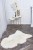 Soft and fluffy natural sheepskin rug in cream colour.